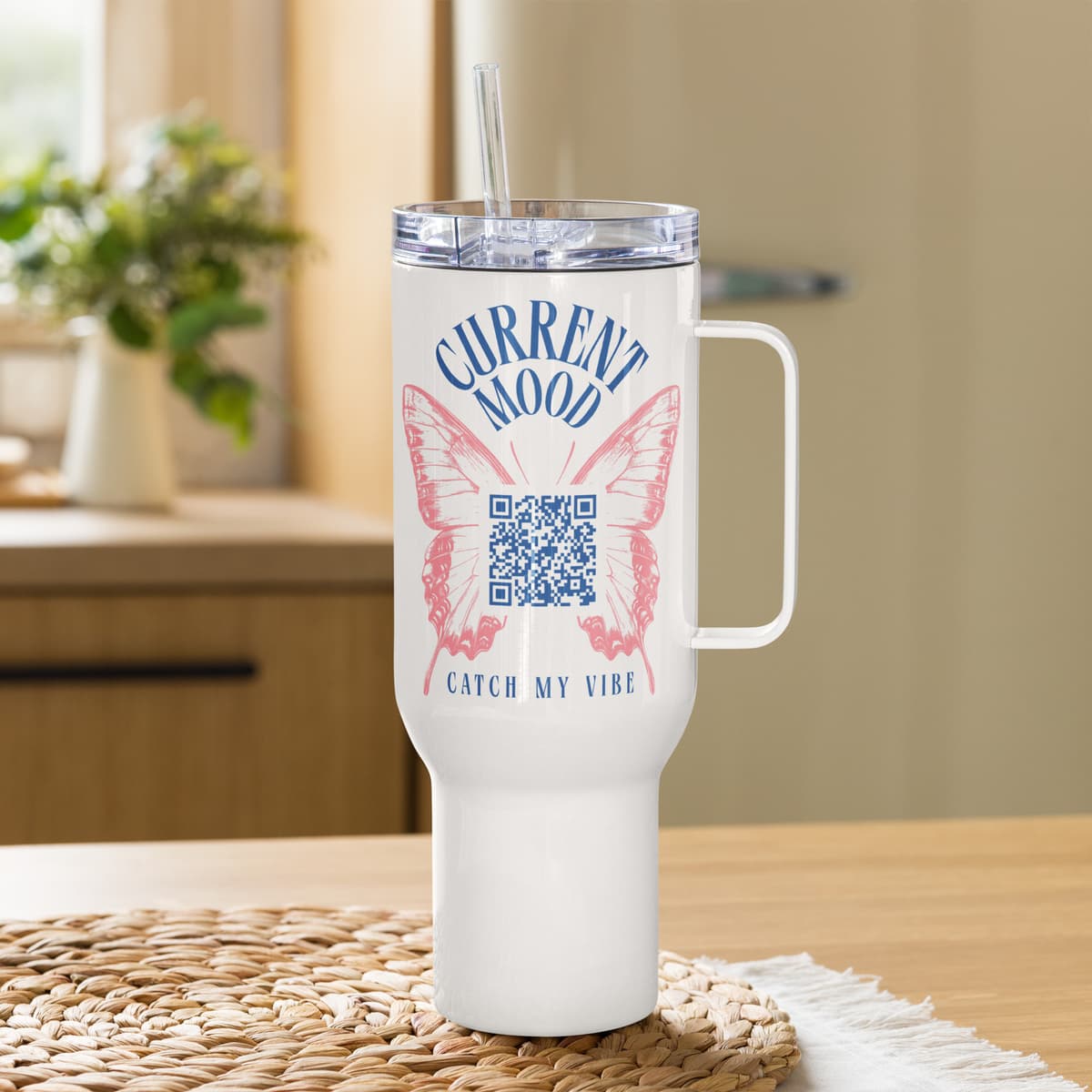 White travel mug with the butterfly QR code printed on it